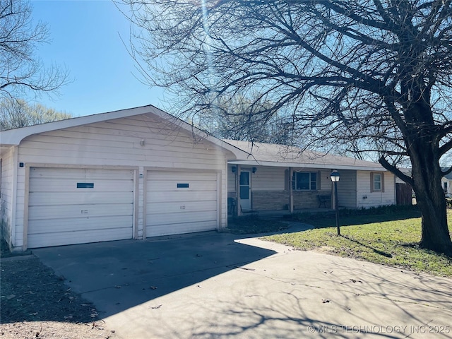306 N Cherokee St, Beggs, OK 74421 - ranch-style house with an attached garage, concrete driveway, and a front lawn