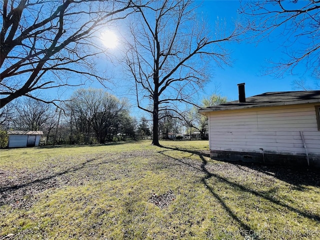 306 N Cherokee St, Beggs, OK 74421 - view of yard featuring an outbuilding