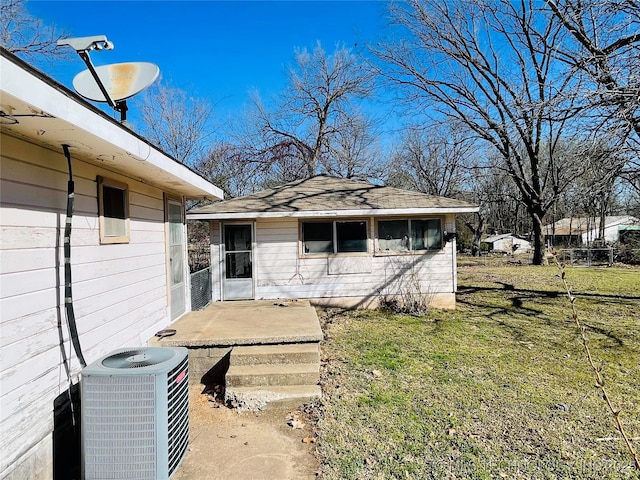 306 N Cherokee St, Beggs, OK 74421 - exterior space featuring central air condition unit and a lawn