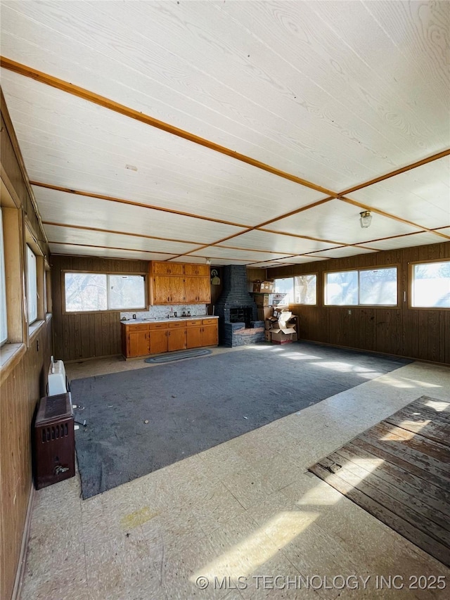 306 N Cherokee St, Beggs, OK 74421 - interior space featuring wooden walls and a wood stove