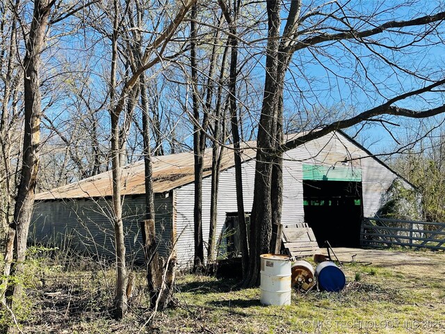 306 N Cherokee St, Beggs, OK 74421 - view of outbuilding featuring fence