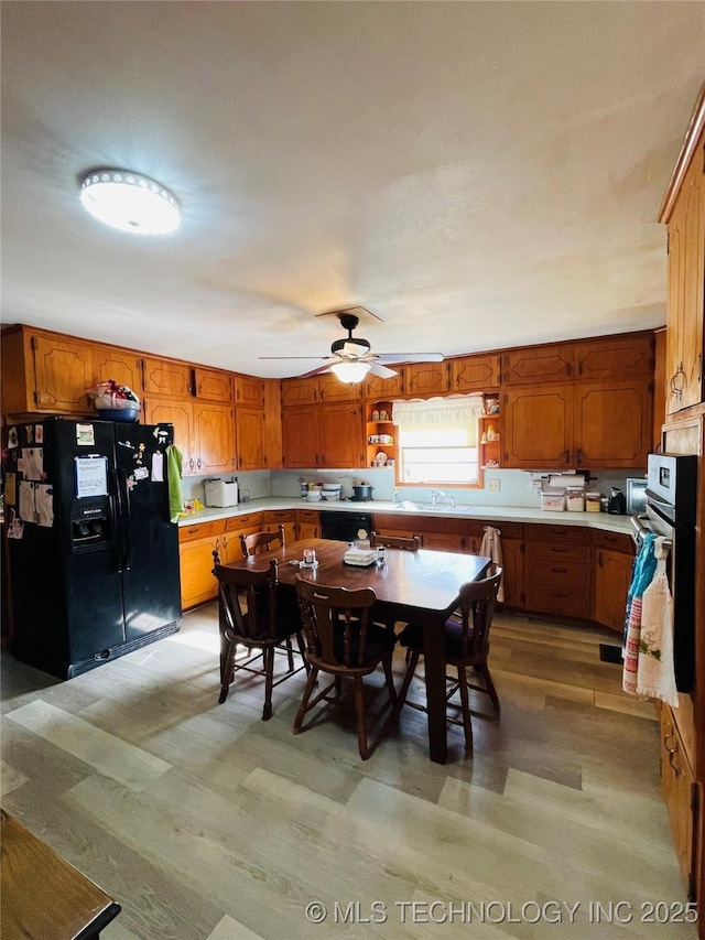 306 N Cherokee St, Beggs, OK 74421 - dining room featuring ceiling fan and light wood-style flooring