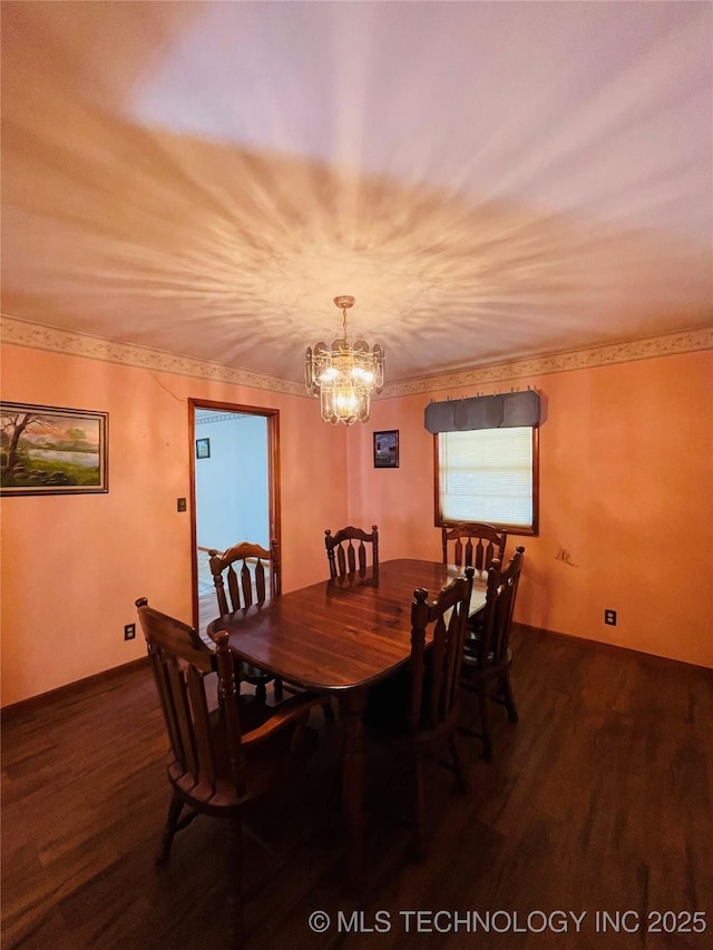306 N Cherokee St, Beggs, OK 74421 - dining room featuring a notable chandelier, wood finished floors, and ornamental molding