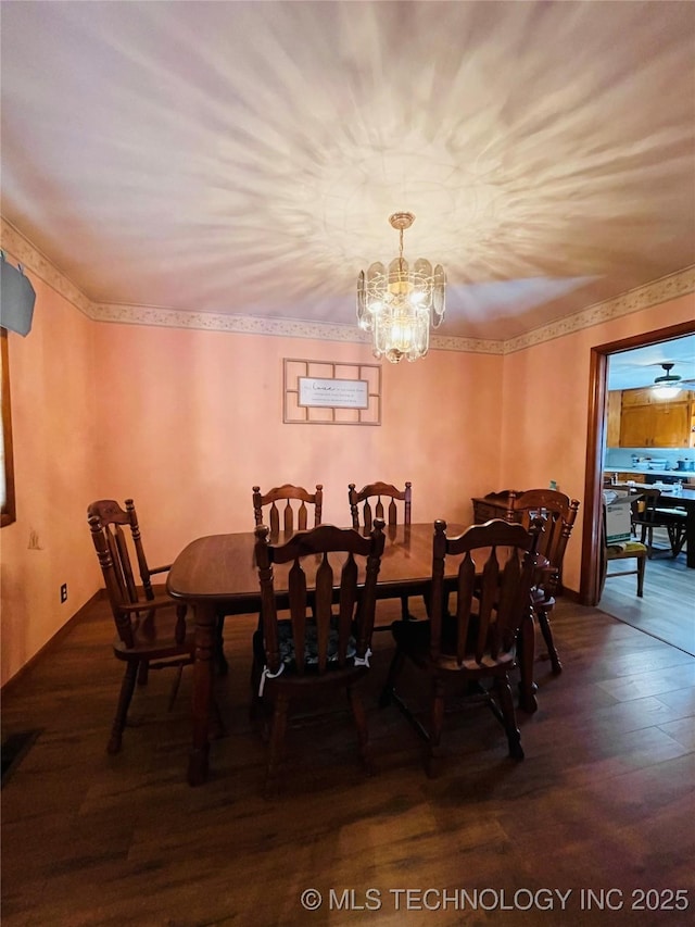 306 N Cherokee St, Beggs, OK 74421 - dining area featuring a notable chandelier, wood finished floors, and ornamental molding