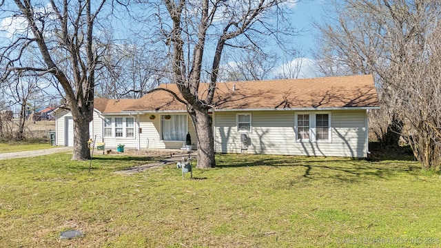 302 W 4th St, Skiatook, OK 74070 - ranch-style home featuring a garage, driveway, roof with shingles, and a front yard