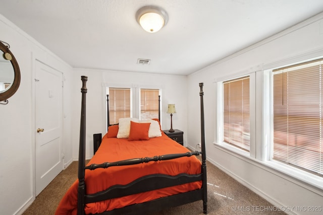302 W 4th St, Skiatook, OK 74070 - bedroom featuring baseboards, visible vents, and carpet floors