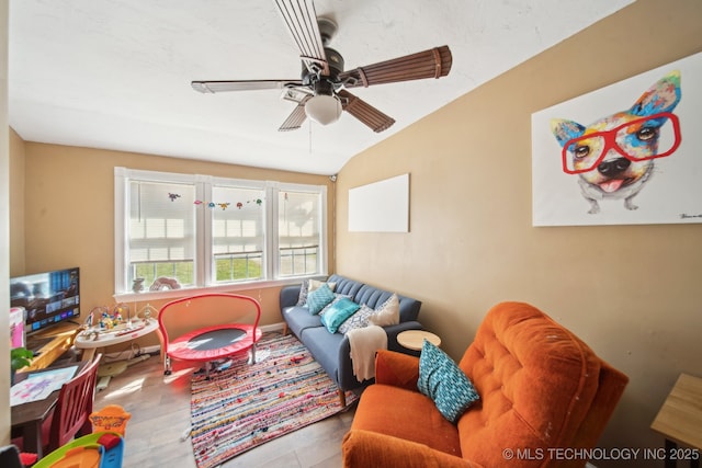 302 W 4th St, Skiatook, OK 74070 - living room featuring vaulted ceiling and a ceiling fan