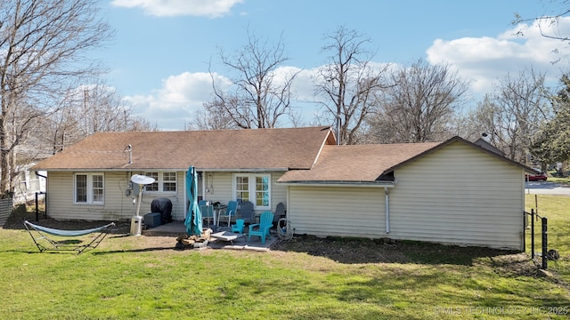 302 W 4th St, Skiatook, OK 74070 - rear view of property featuring a patio, a shingled roof, a yard, and fence