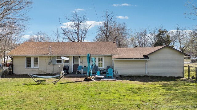 302 W 4th St, Skiatook, OK 74070 - rear view of property with a yard, a patio, and fence