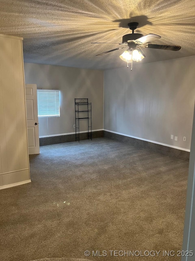 12802 E 31st Ct, Tulsa, OK 74146 - unfurnished room featuring baseboards, dark carpet, a textured ceiling, and a ceiling fan