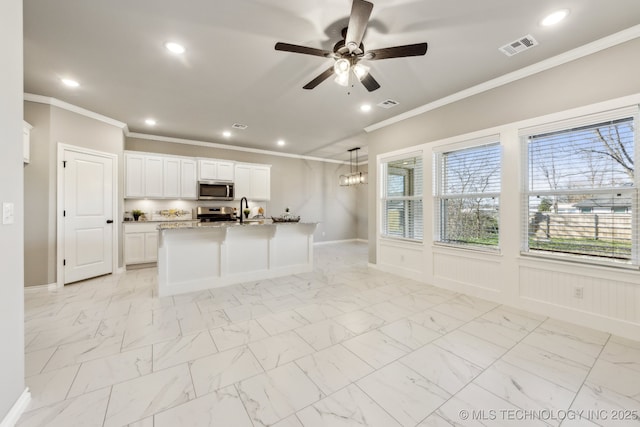 kitchen with visible vents, a sink, ceiling fan, appliances with stainless steel finishes, and marble finish floor