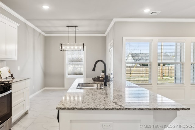 kitchen featuring a sink, visible vents, marble finish floor, and crown molding