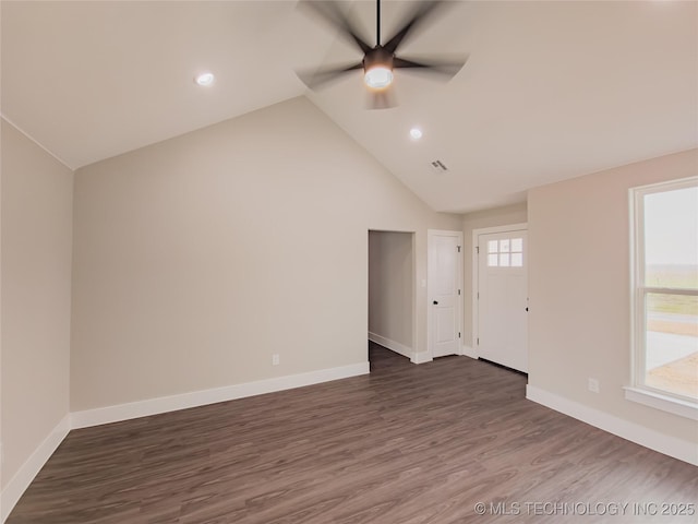 unfurnished living room featuring dark wood finished floors, recessed lighting, baseboards, ceiling fan, and vaulted ceiling