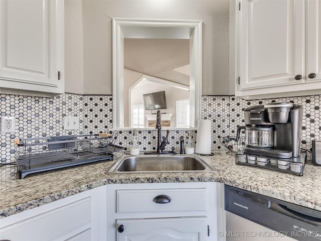 7610 N 127th E Ave, Owasso, OK 74055 - kitchen featuring a sink, stainless steel dishwasher, backsplash, and white cabinets
