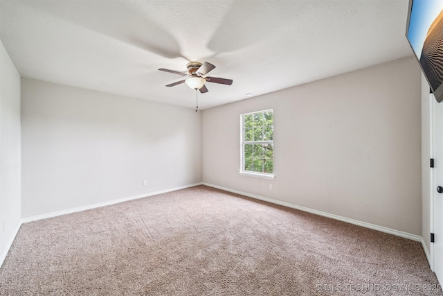7610 N 127th E Ave, Owasso, OK 74055 - spare room with a ceiling fan, carpet flooring, and baseboards