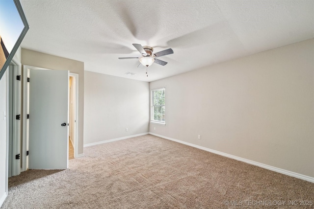 7610 N 127th E Ave, Owasso, OK 74055 - empty room featuring ceiling fan, carpet floors, a textured ceiling, and baseboards
