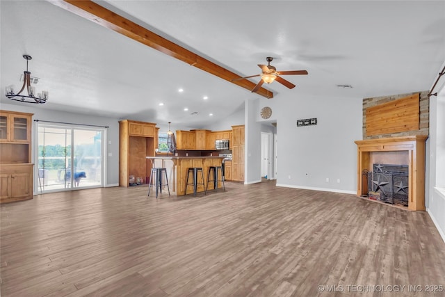 922 Oak Ridge St, Ardmore, OK 73401 - living room featuring wood finished floors, ceiling fan, a fireplace, and recessed lighting