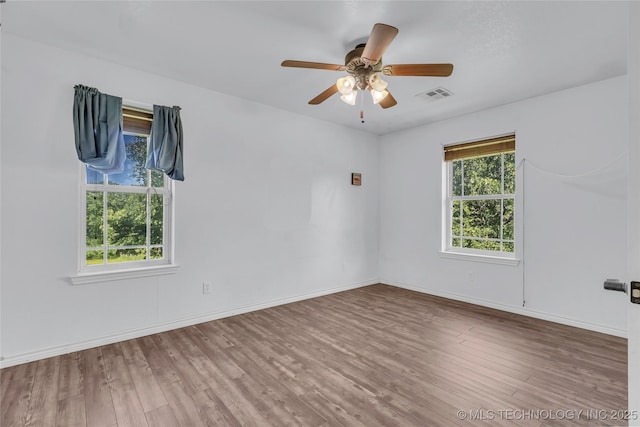 922 Oak Ridge St, Ardmore, OK 73401 - unfurnished room featuring wood finished floors, ceiling fan, and baseboards