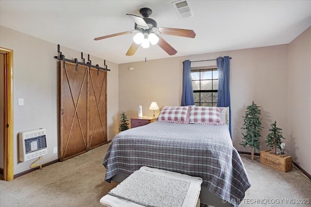 420722 E 1920th Rd, Antlers, OK 74523 - bedroom with visible vents, baseboards, a barn door, carpet floors, and heating unit
