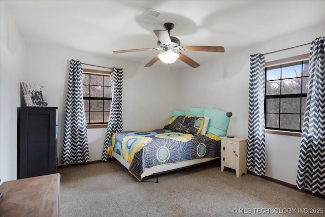 420722 E 1920th Rd, Antlers, OK 74523 - carpeted bedroom with multiple windows, baseboards, and ceiling fan