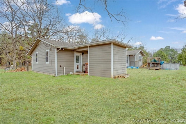 420722 E 1920th Rd, Antlers, OK 74523 - back of house featuring a deck, a yard, and fence