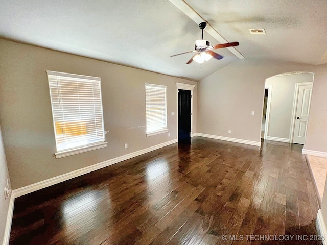 4169 Highland Dr, Tahlequah, OK 74464 - spare room featuring arched walkways, wood finished floors, a ceiling fan, and baseboards