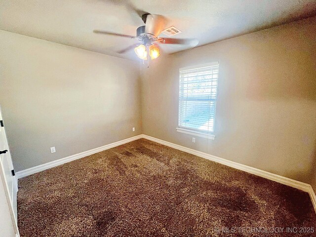 4169 Highland Dr, Tahlequah, OK 74464 - spare room featuring a ceiling fan, carpet flooring, and baseboards