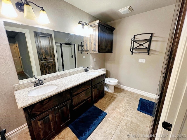 4169 Highland Dr, Tahlequah, OK 74464 - bathroom featuring a shower stall, double vanity, toilet, tile patterned flooring, and baseboards
