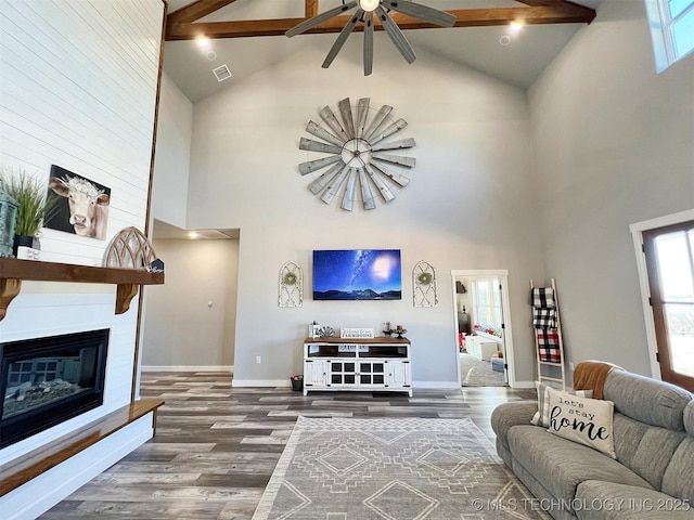 11457 N 510th Rd, Tahlequah, OK 74464 - living room featuring high vaulted ceiling, a ceiling fan, beamed ceiling, baseboards, and wood finished floors