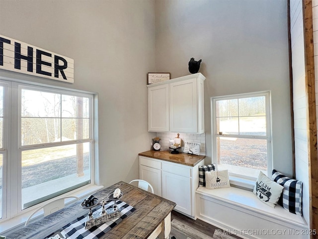 11457 N 510th Rd, Tahlequah, OK 74464 - dining room featuring a high ceiling, healthy amount of natural light, and dark wood finished floors