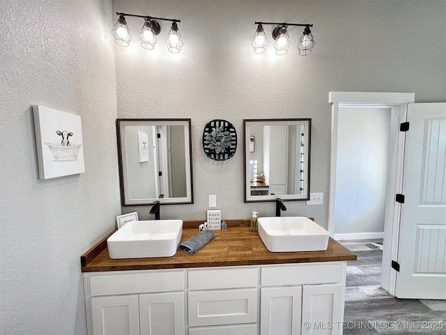 11457 N 510th Rd, Tahlequah, OK 74464 - full bathroom featuring wood finished floors and double vanity