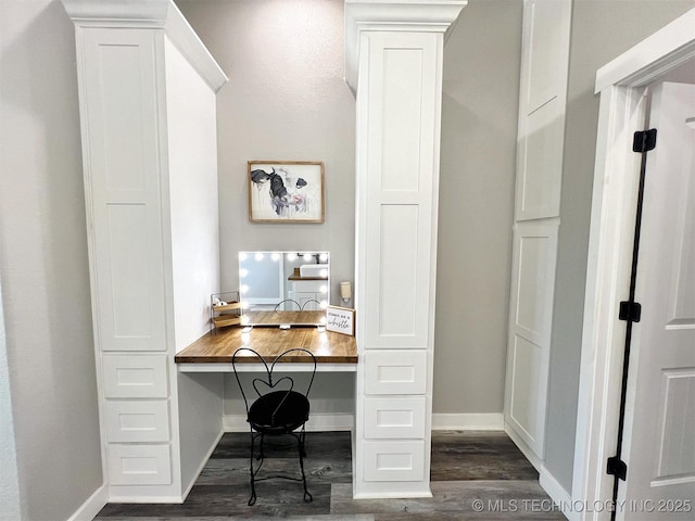 11457 N 510th Rd, Tahlequah, OK 74464 - home office with dark wood-style floors, built in study area, and baseboards