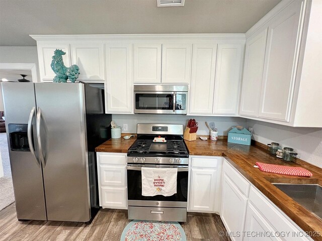 11457 N 510th Rd, Tahlequah, OK 74464 - kitchen with appliances with stainless steel finishes and white cabinets