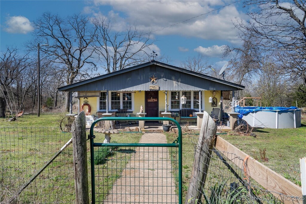 96474 S 4450th Rd, Gore, OK 74435 - bungalow-style home featuring an exterior structure, a covered pool, and an outbuilding