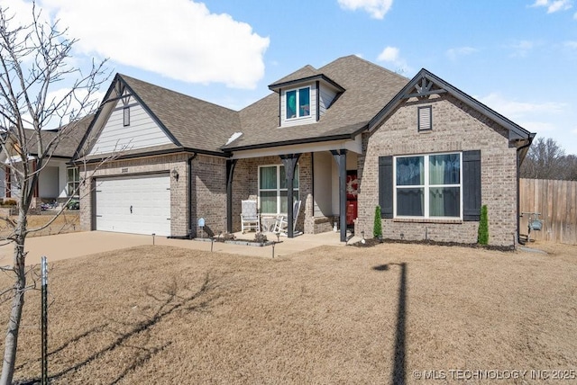 view of front of home featuring roof with shingles, concrete driveway, fence, brick siding, and an attached garage