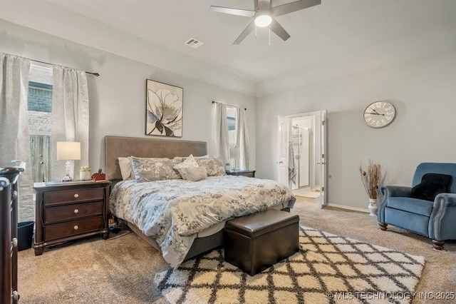 bedroom featuring baseboards, visible vents, carpet floors, and multiple windows