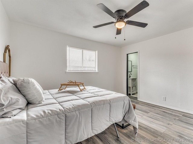 bedroom featuring baseboards, light wood-type flooring, and a ceiling fan