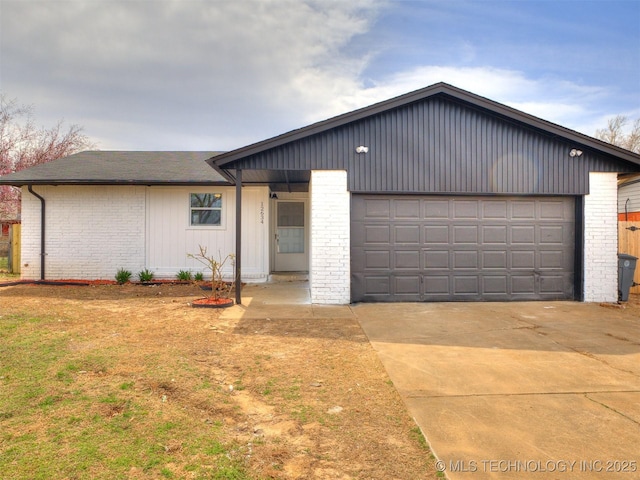 single story home featuring brick siding, driveway, and a shingled roof