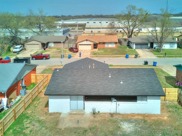birds eye view of property with a residential view