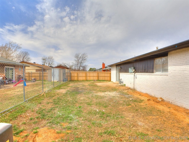 view of yard featuring a fenced backyard