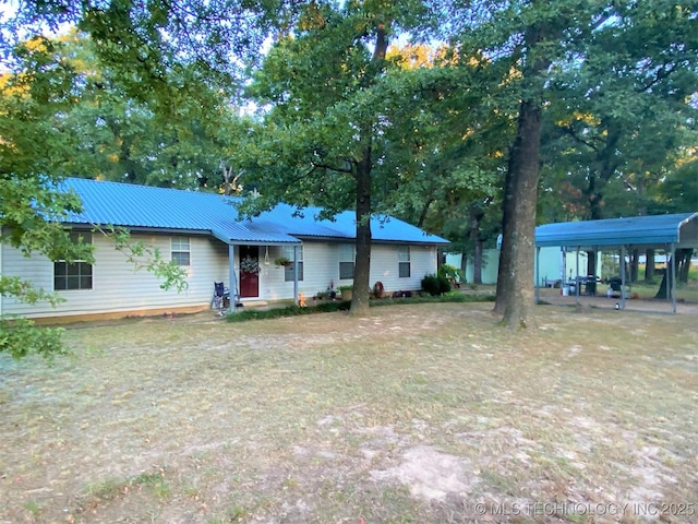 4110 Derrick St, Kingston, OK 73439 - single story home featuring metal roof and a carport