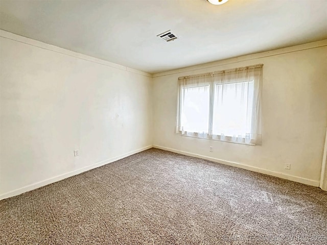 111 N Logan Dr, Tahlequah, OK 74464 - carpeted spare room featuring baseboards