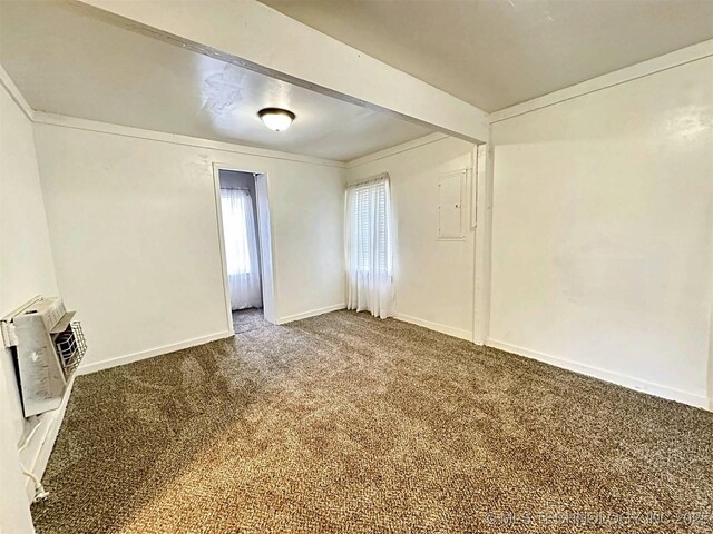 111 N Logan Dr, Tahlequah, OK 74464 - carpeted spare room featuring a wall mounted AC and baseboards