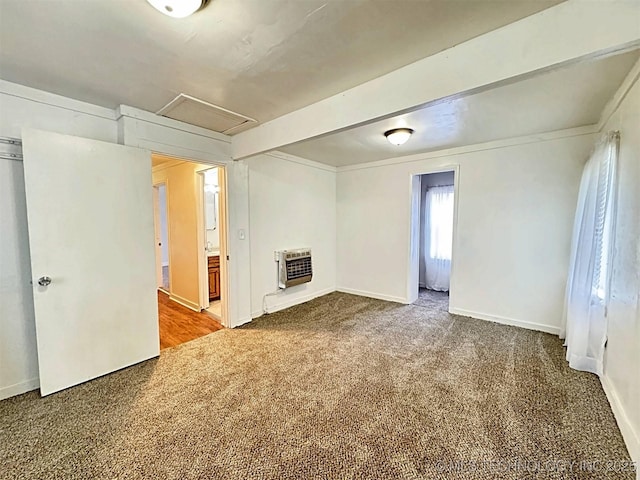 111 N Logan Dr, Tahlequah, OK 74464 - unfurnished living room featuring heating unit, carpet, attic access, and baseboards