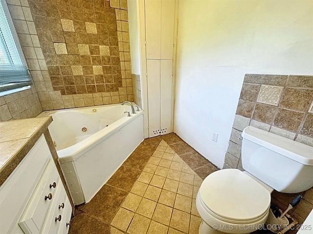 111 N Logan Dr, Tahlequah, OK 74464 - bathroom with toilet, a jetted tub, tile walls, and tile patterned flooring
