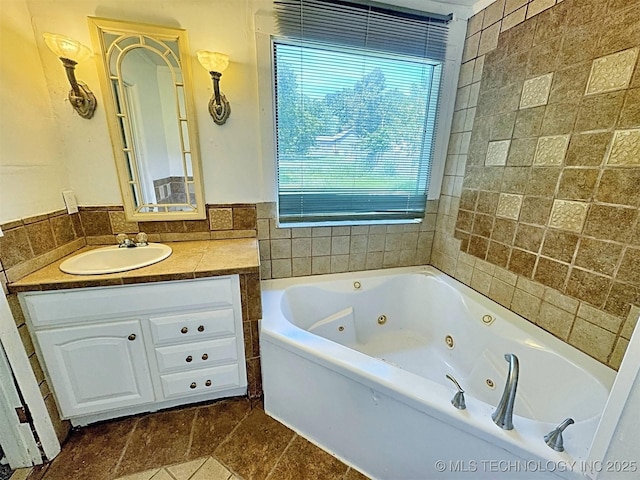 111 N Logan Dr, Tahlequah, OK 74464 - bathroom with healthy amount of natural light, a whirlpool tub, vanity, and tile patterned floors