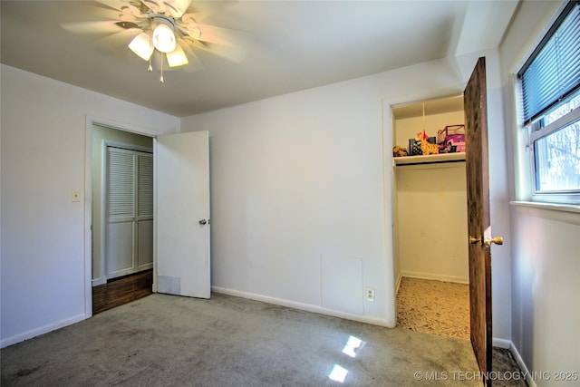 6508 W Cameron St, Sand Springs, OK 74127 - unfurnished bedroom with a walk in closet, ceiling fan, baseboards, carpet, and a closet