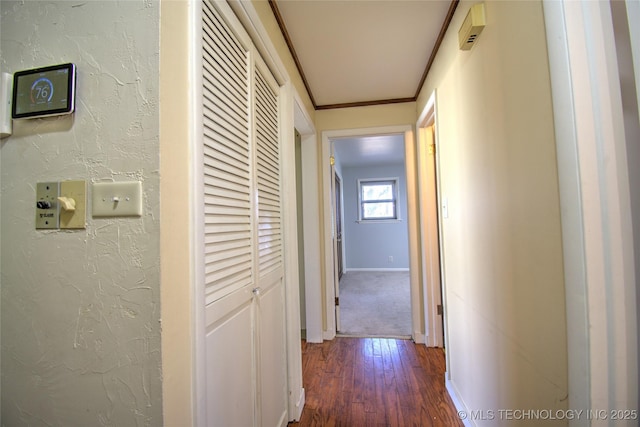 6508 W Cameron St, Sand Springs, OK 74127 - hallway featuring dark wood-style floors, a textured wall, baseboards, and ornamental molding