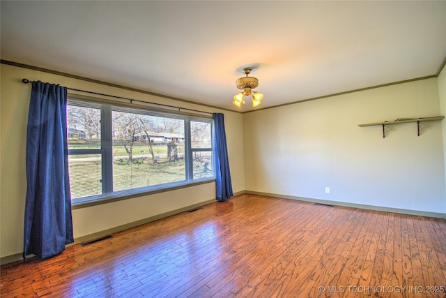 6508 W Cameron St, Sand Springs, OK 74127 - unfurnished room featuring visible vents, wood-type flooring, baseboards, and ornamental molding