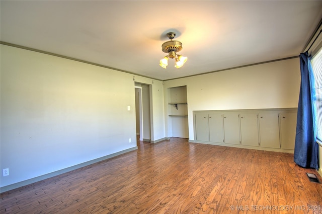 6508 W Cameron St, Sand Springs, OK 74127 - unfurnished room with visible vents, crown molding, ceiling fan, and wood finished floors